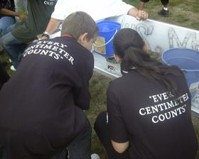 Team Germany weighs its marbles at Edgewood School's Metric Olympics Thursday.