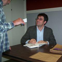 Mark Oppenheimer signing books at the library Thursday.