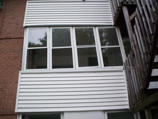 A rotting upstairs back porch right before it came down Monday.