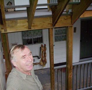 Superintendent Mikhail Kirichenko shows off one of the new back porches at the Imperial.