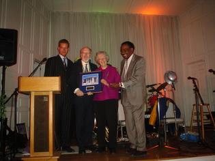 The party's formal portion included library board prez Michael Morand and City Librarian James Welbourne presenting William and Jean Graustein with their award.