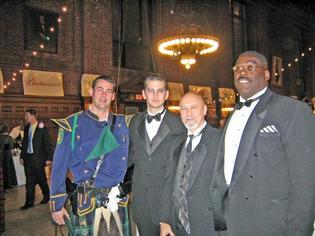 That may be a halo, or else it's a chandelier, over tuxedoed Aldermen Al Paolillo, Sergio Rodriguez and Charles Blango.