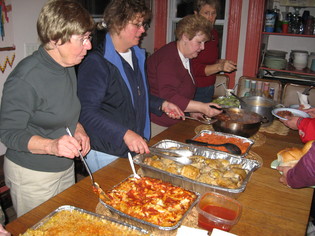 women%20serving%20food.JPG